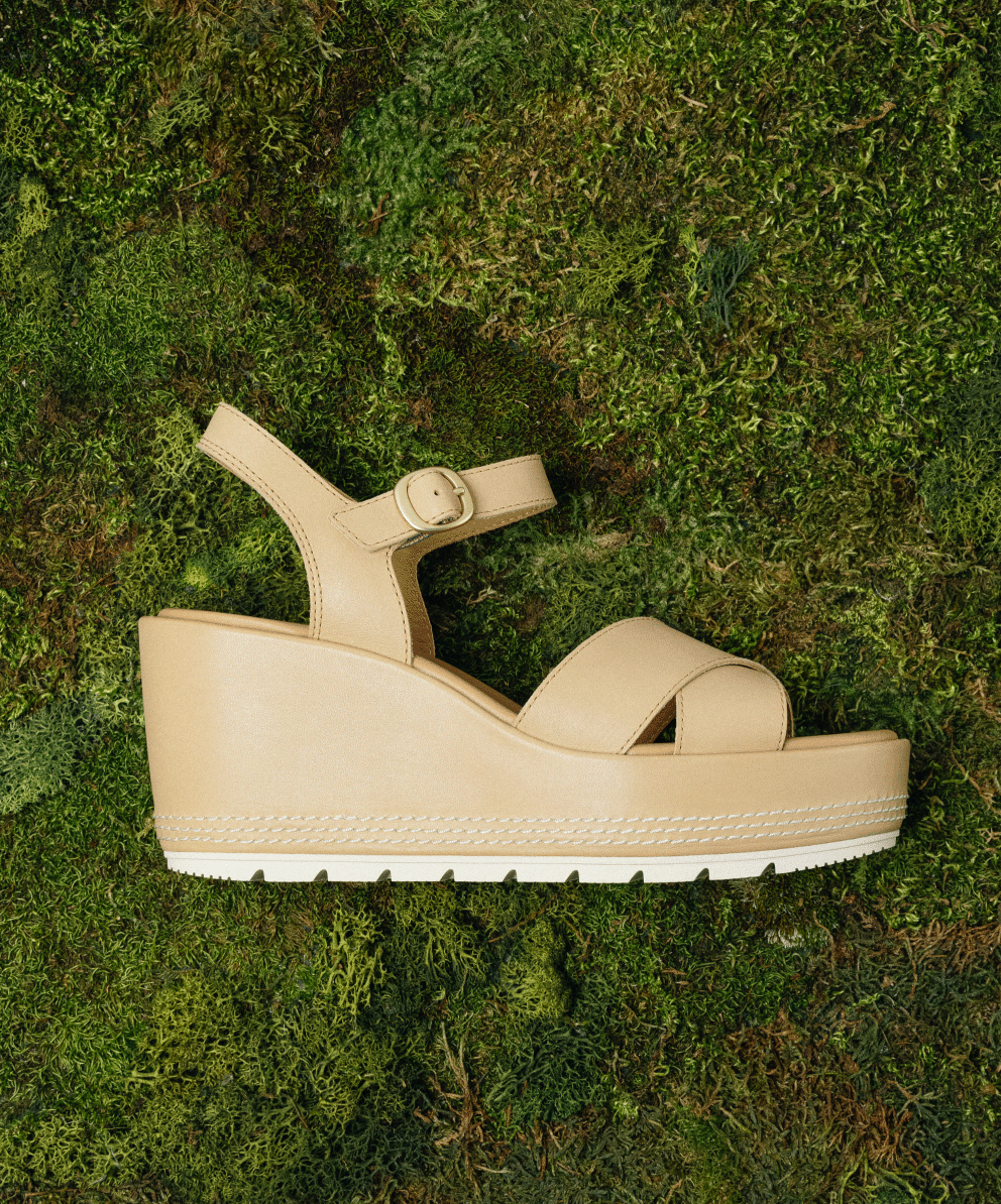 Sunpeak™ Wedge Ankle Strap in Honest Beige & Chalk photographed on grass