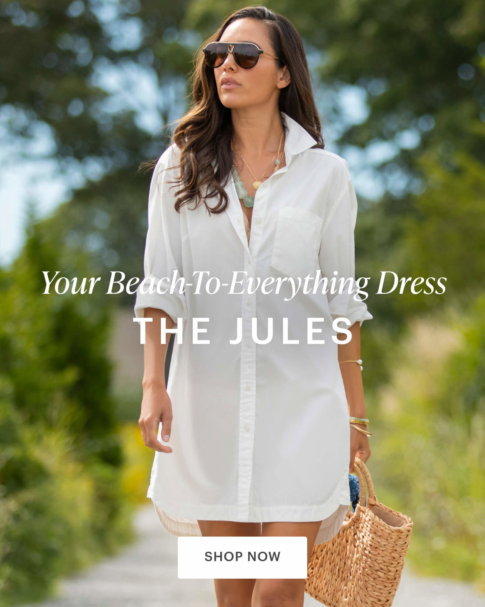 Woman in Jules Dress walking on path surrounded by greenery. 
