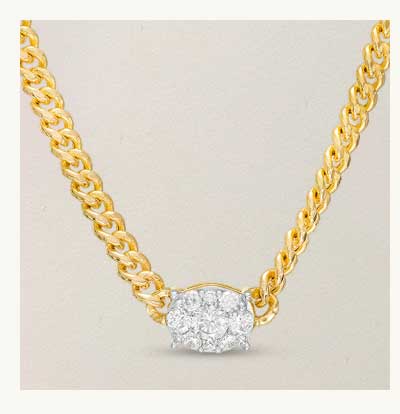 Gold chain necklace with diamond cluster pendant.