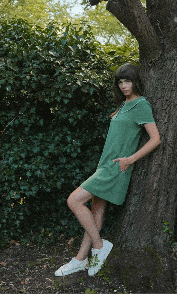 Gif of the model wearing the Dot blanket stitch green dress.