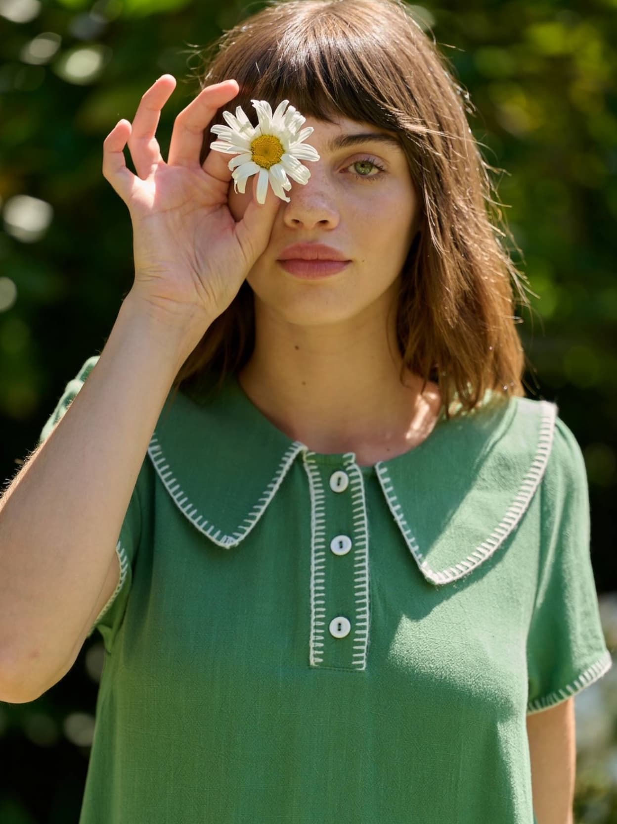 Model wearing the Dot blanket stitch green dress.