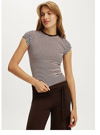 Woman wearing striped short sleeve tee and brown pants