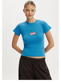 Woman wearing bright blue short sleeve t-shirt and black pants