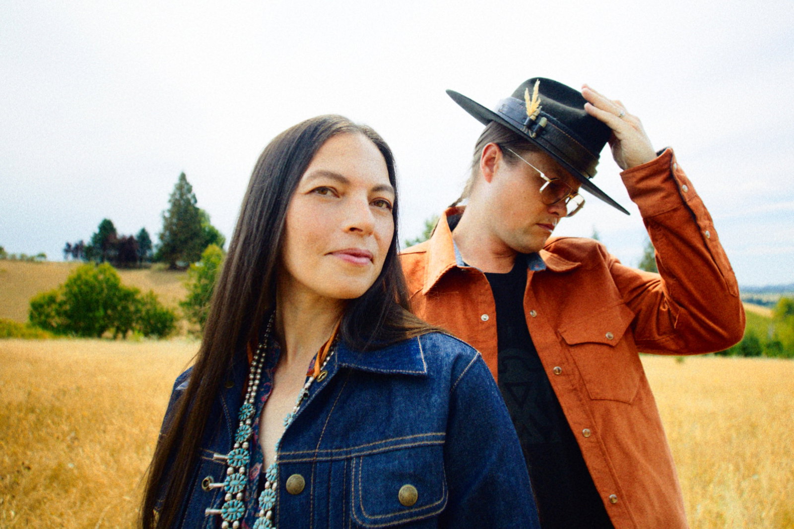 Founders Erik and Amanda In a Straw Field