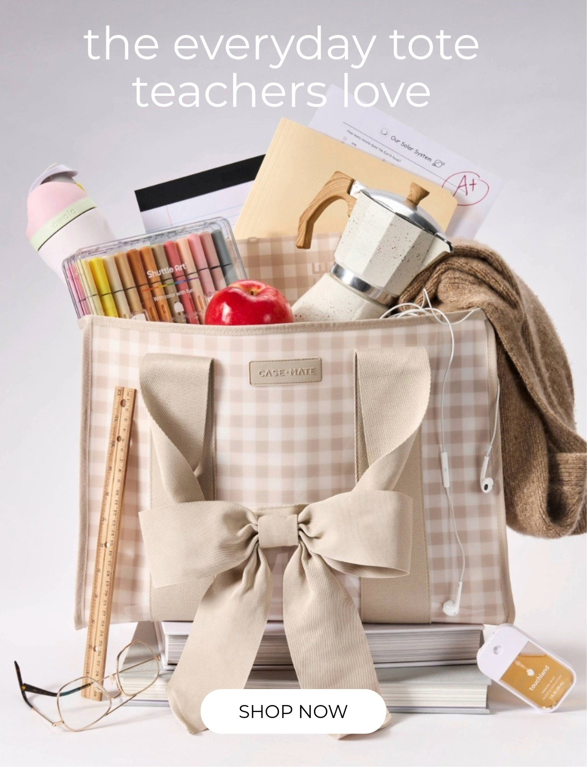 The Latte Gingham Bow Jelly Tote stuffed with school essentials.