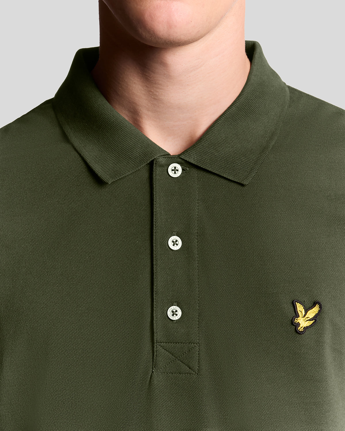 Man wears Cotton Polo Shirt in Olive