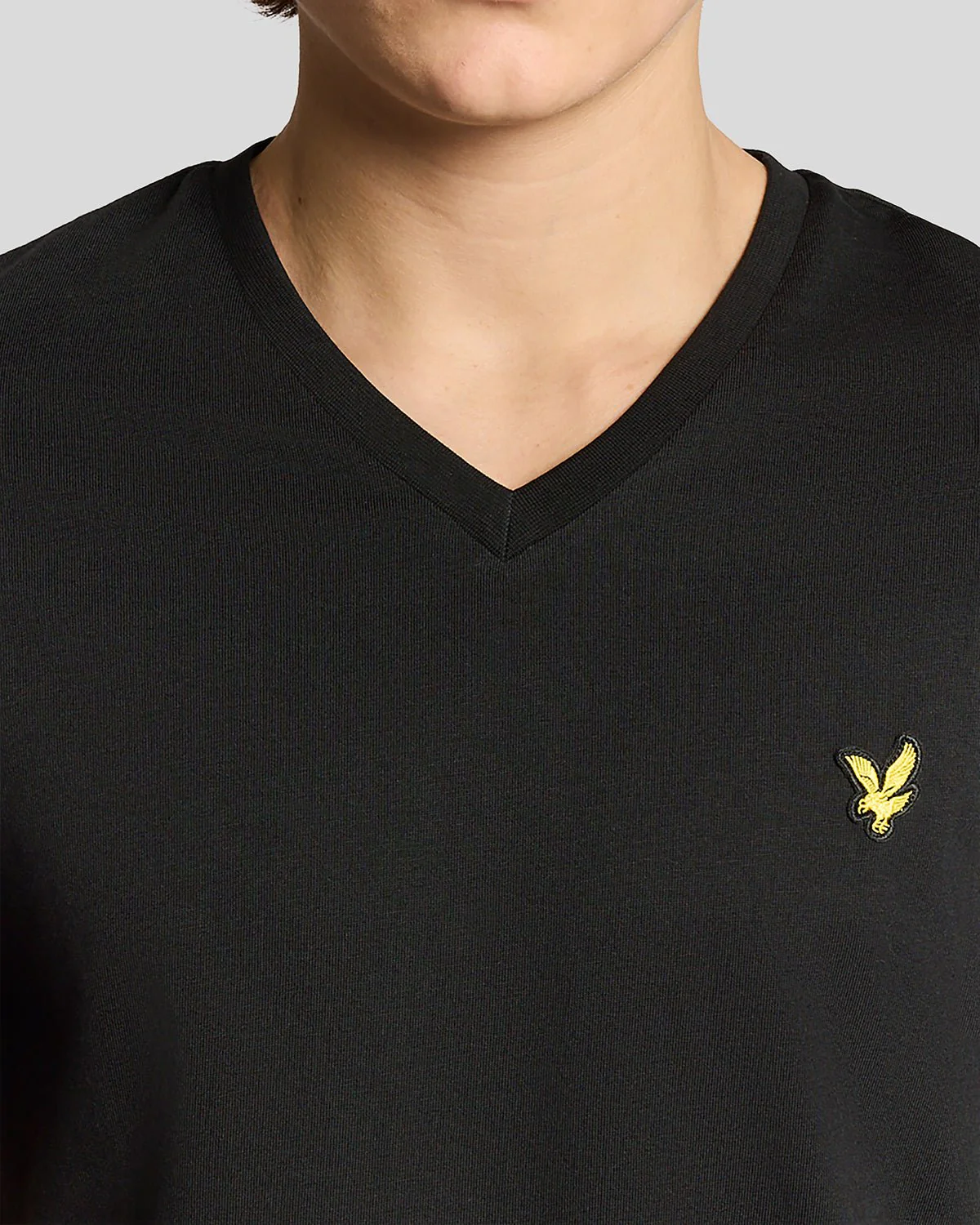 Man wears Cotton V-Neck T-Shirt in Jet Black 