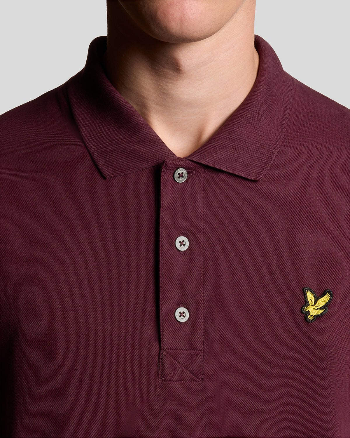 Man wears Cotton Polo Shirt in Burgundy 