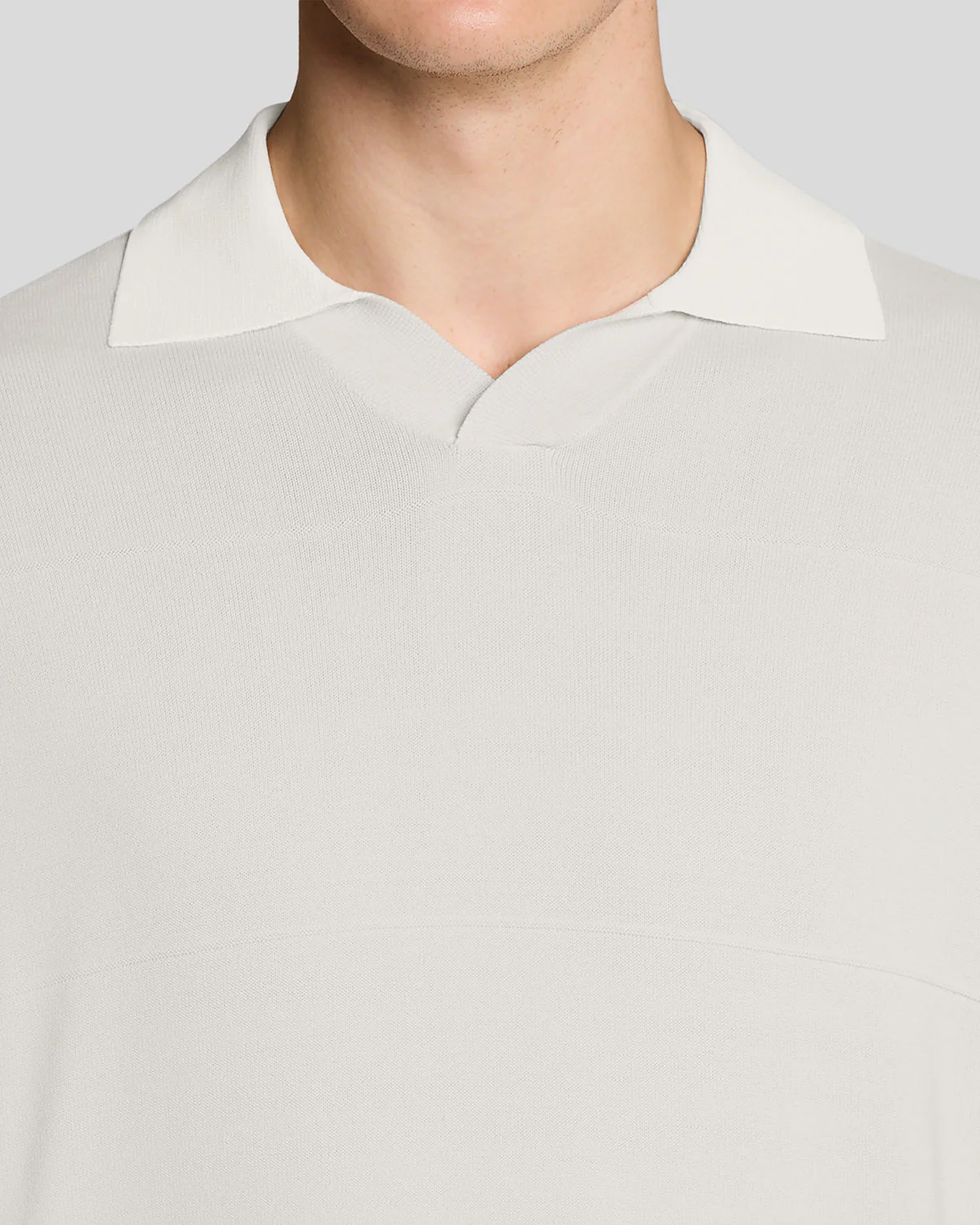Man wears Open Collar Fine Knitted Polo Shirt in Skylight