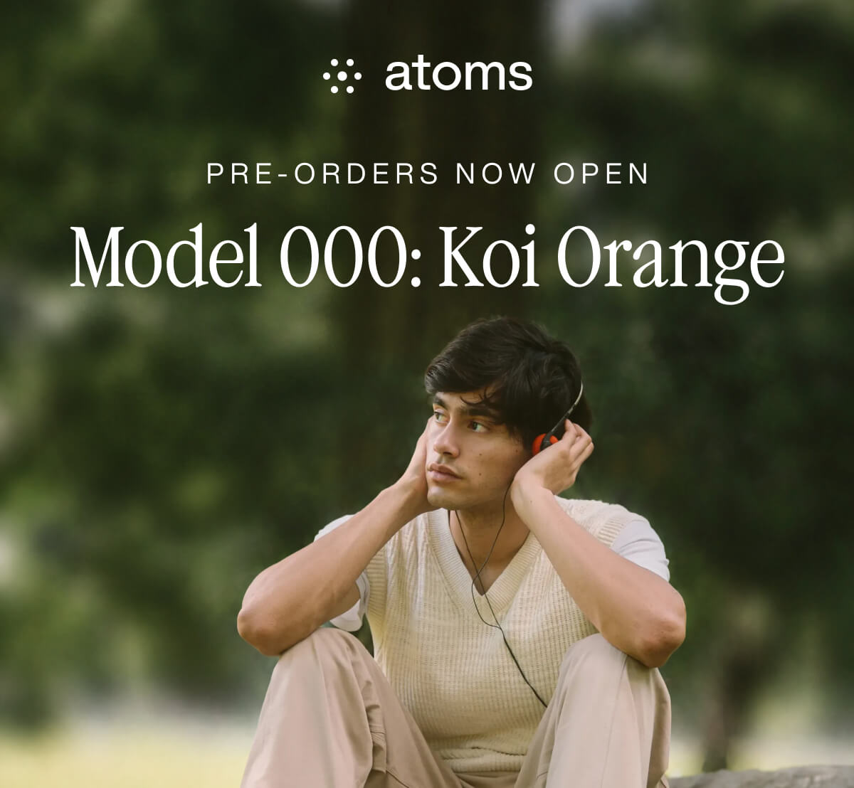 Hero image announcing the Model 000 Koi Orange pre-order featuring a model wearing the new colorway outdoors.