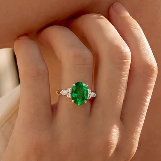 Emerald Side Stone Ring with Diamonds