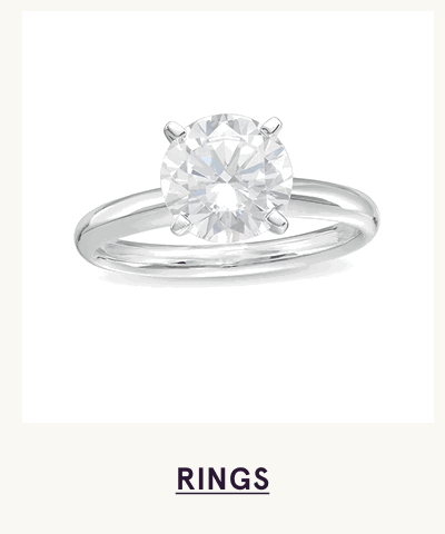 Large, round-cut clear diamond centered on white metal band.  Click here to shop rings
