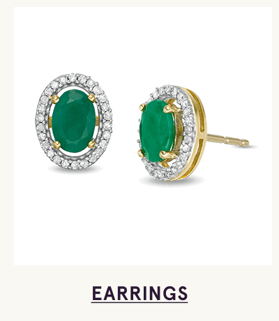 Oval-cut emerald gemstones with border of diamond studs.Click here to shop earrings