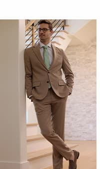 Man poses in the J.M. Haggar Glen Plaid Suit