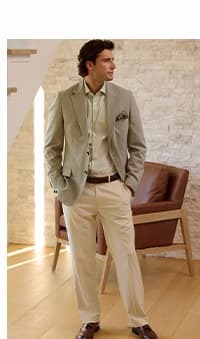 Man poses in the light green J.M. Haggar Glen Plaid sport coat