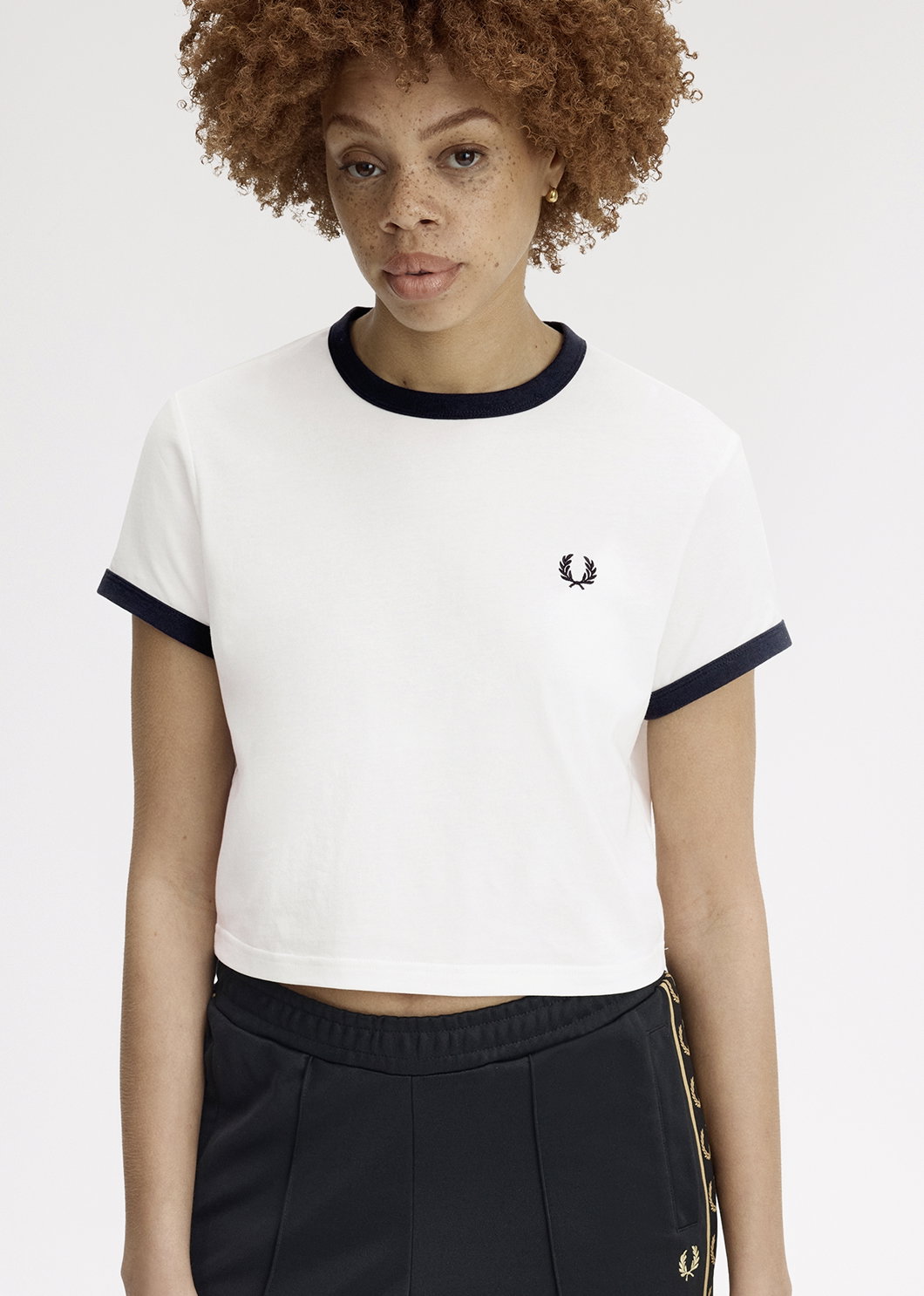 Female model wearing a Fred Perry Cropped Ringer T-Shirt in White