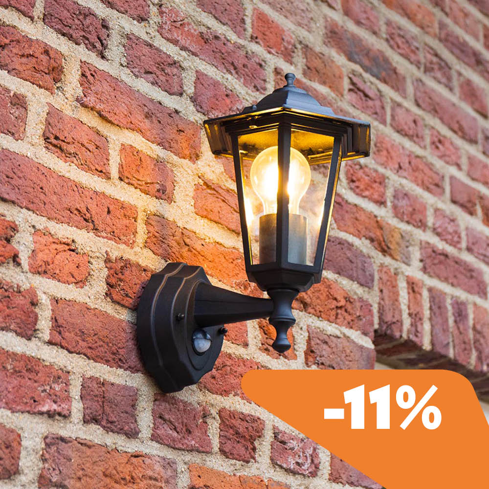 Huron wall light on a stone wall with discount
