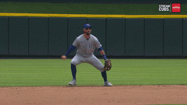 An animated gif of Dansby Swanson making a diving catch