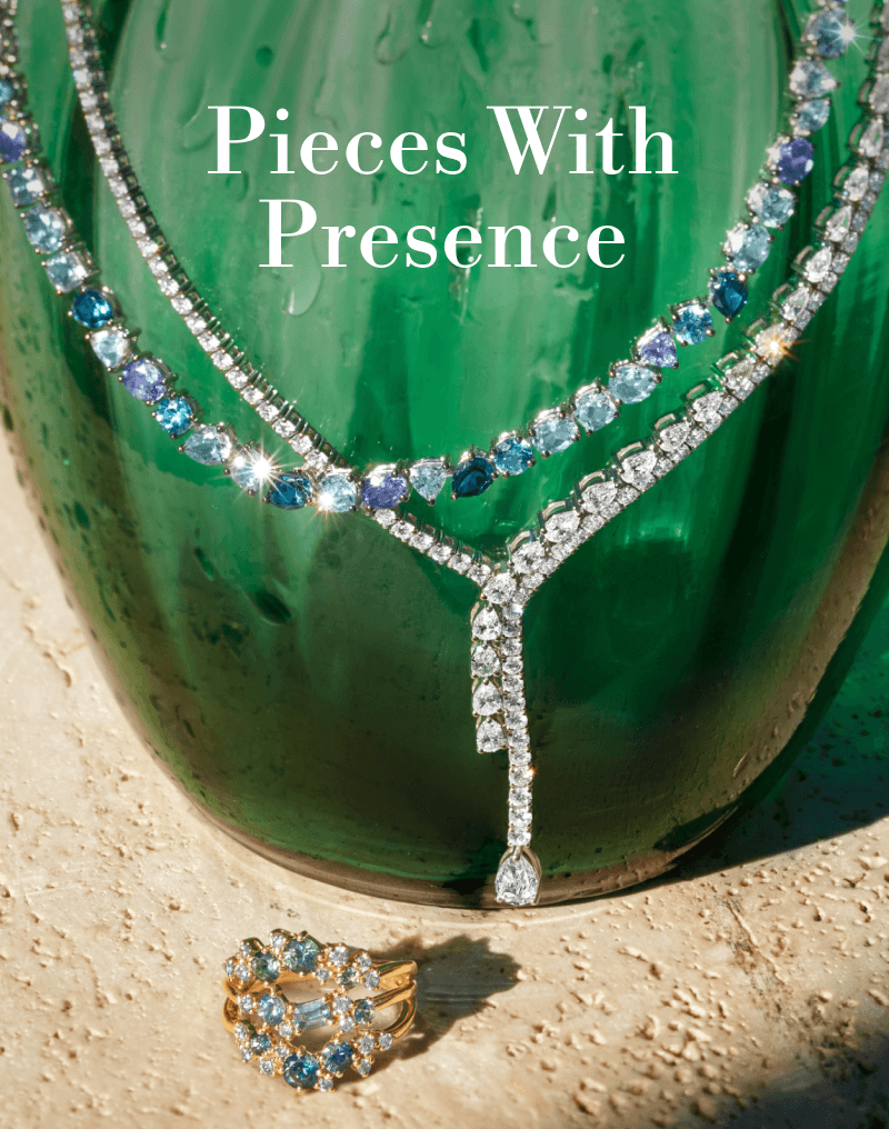 Gemstone and diamond jewelry in a summer scene. Catch the light with layers. Click to Shop Summer Styles