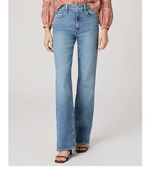 Image of a woman's legs in a pair of blue denim jeans.