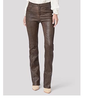 Image of a woman's legs in a pair of brown leather pants.
