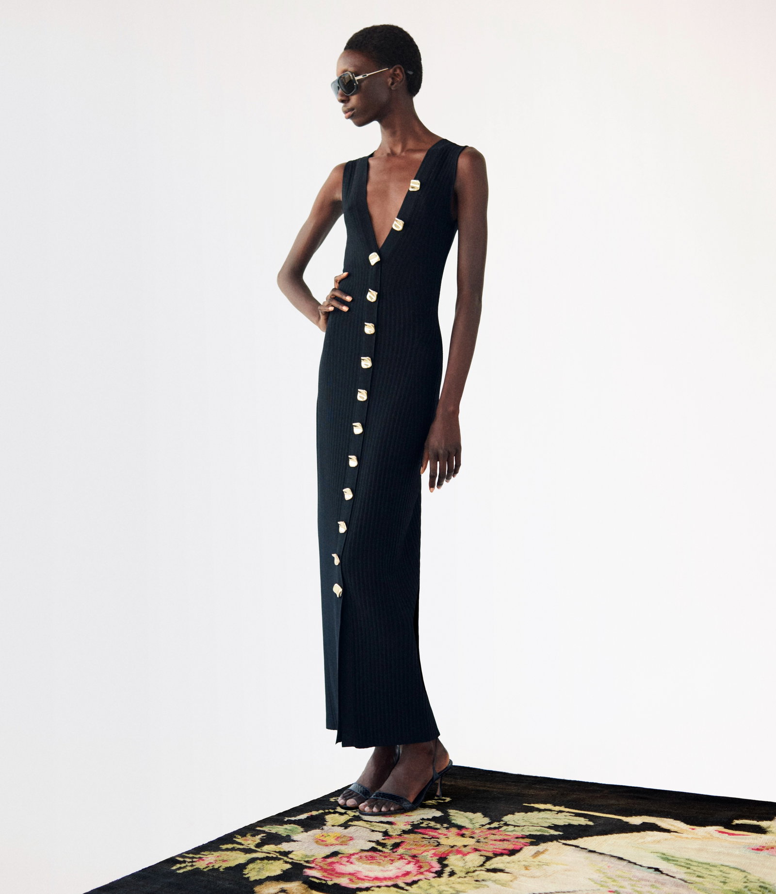 Editorial image of a model wearing the Eliza dress in color black