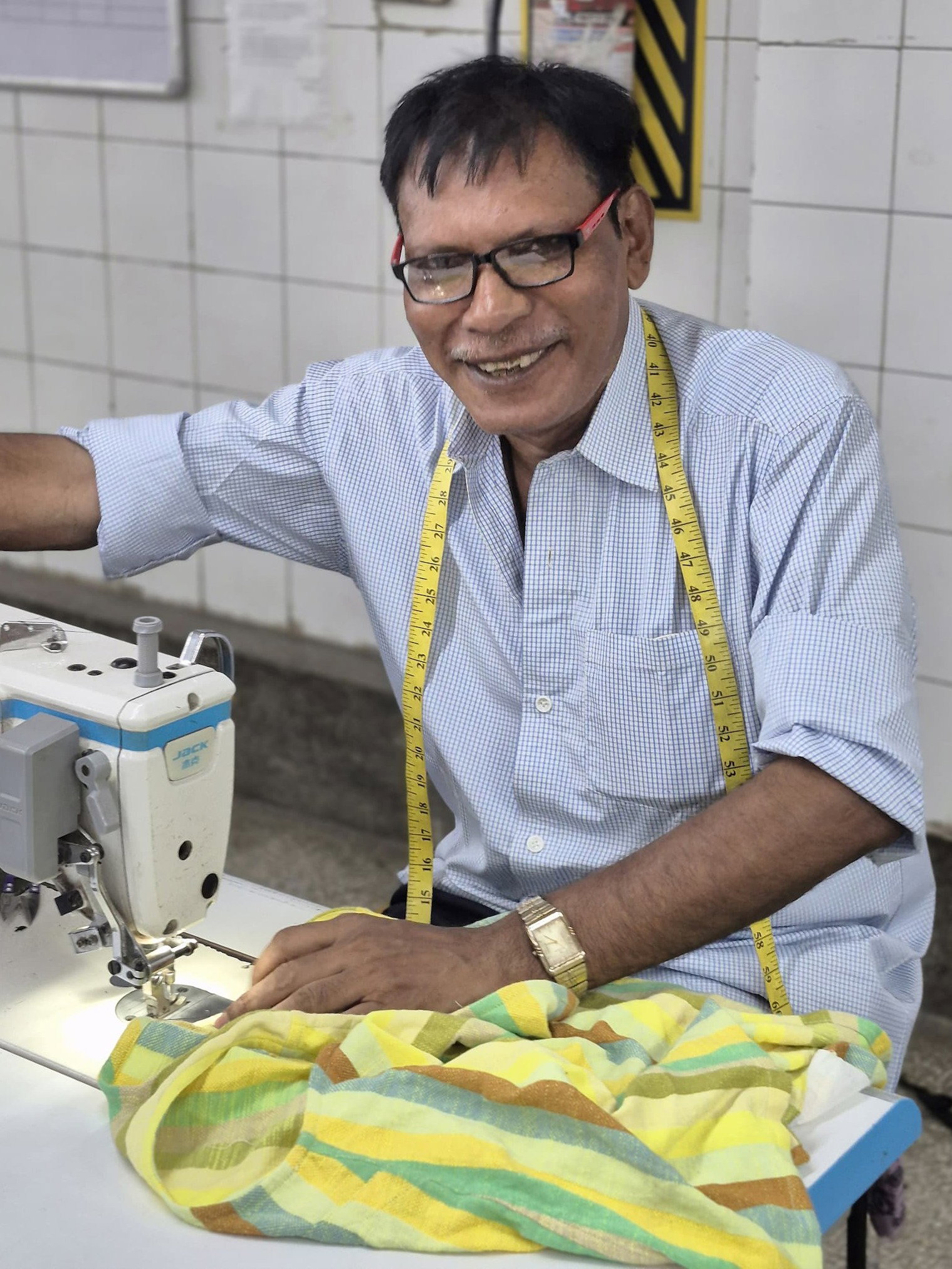 man sewing wave textile