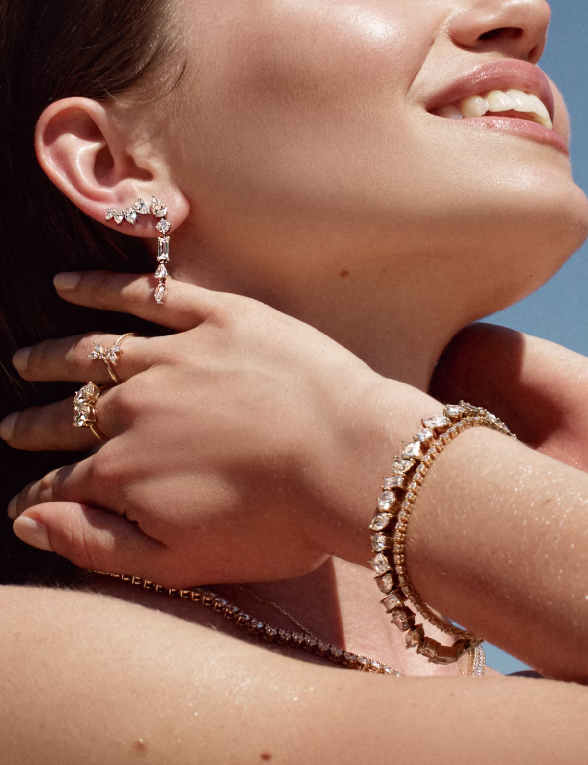 Mix drop earrings, hoops, and studs for daring summer style.