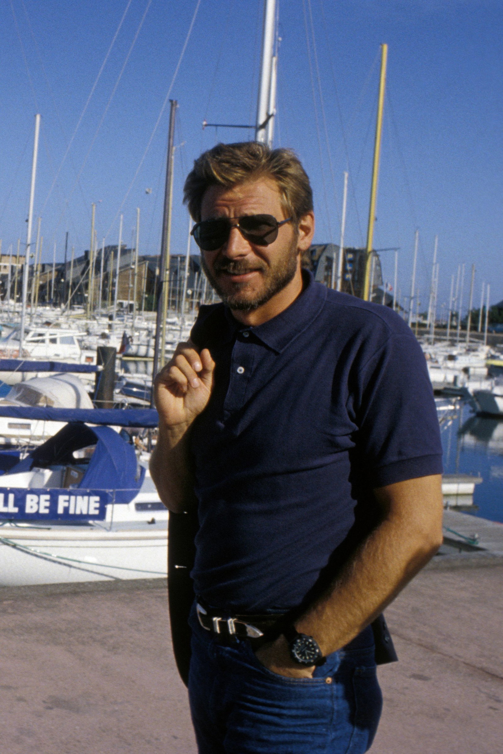 Image may contain: Harrison Ford, Water, Waterfront, Boat, Sailboat, Transportation, Vehicle, Harbor, Pier, Yacht, and Face