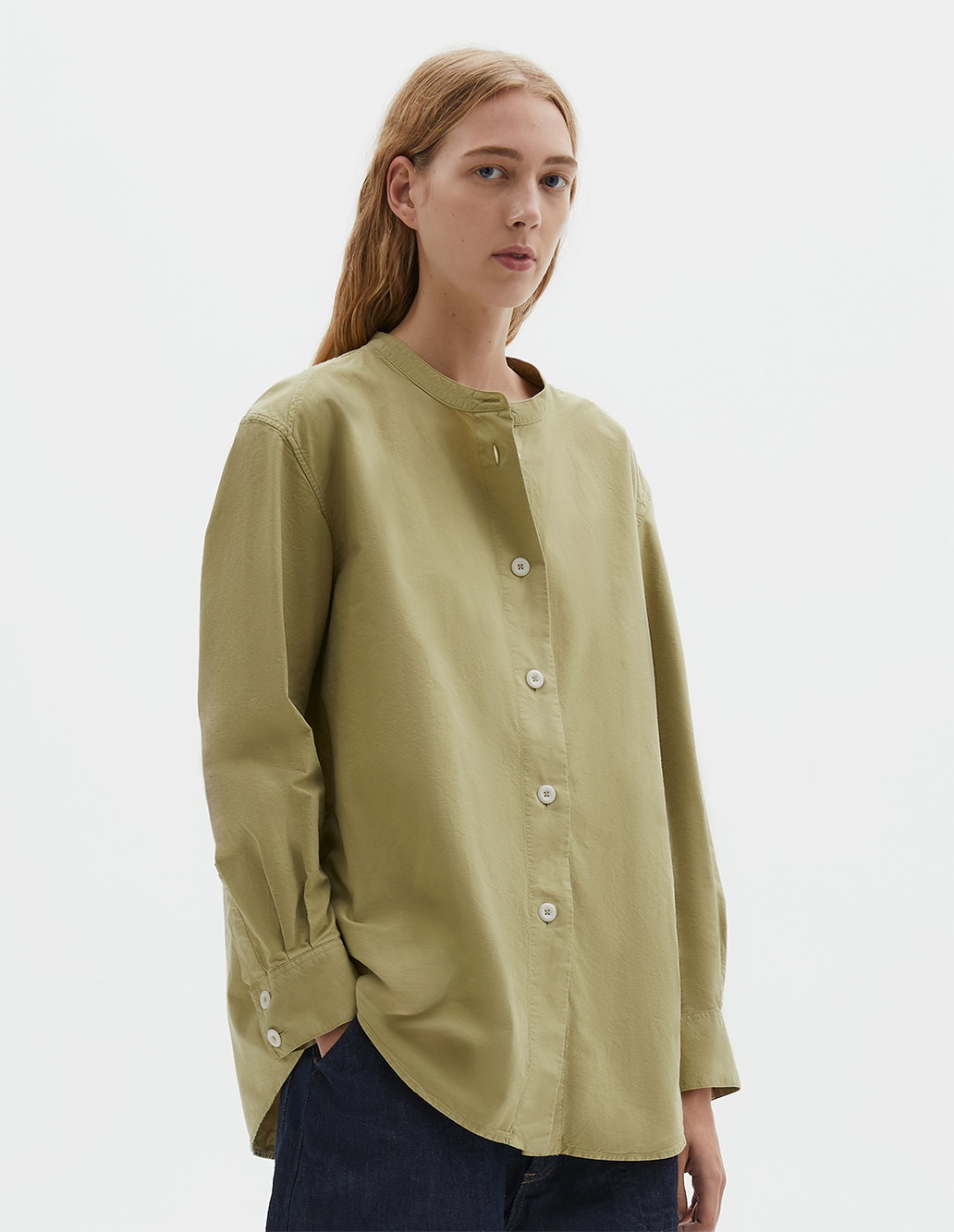 Pale green long collarless shirt.