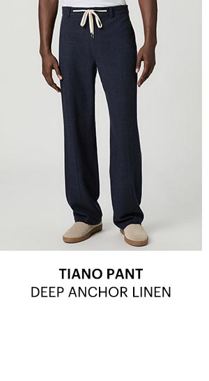 A man's legs wearing navy pants.