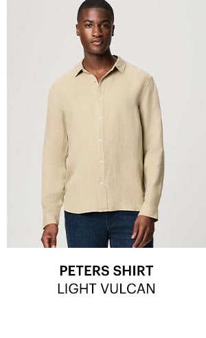 A man wearing a beige button up.