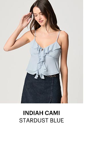 An image of a woman wearing a light blue camisole.