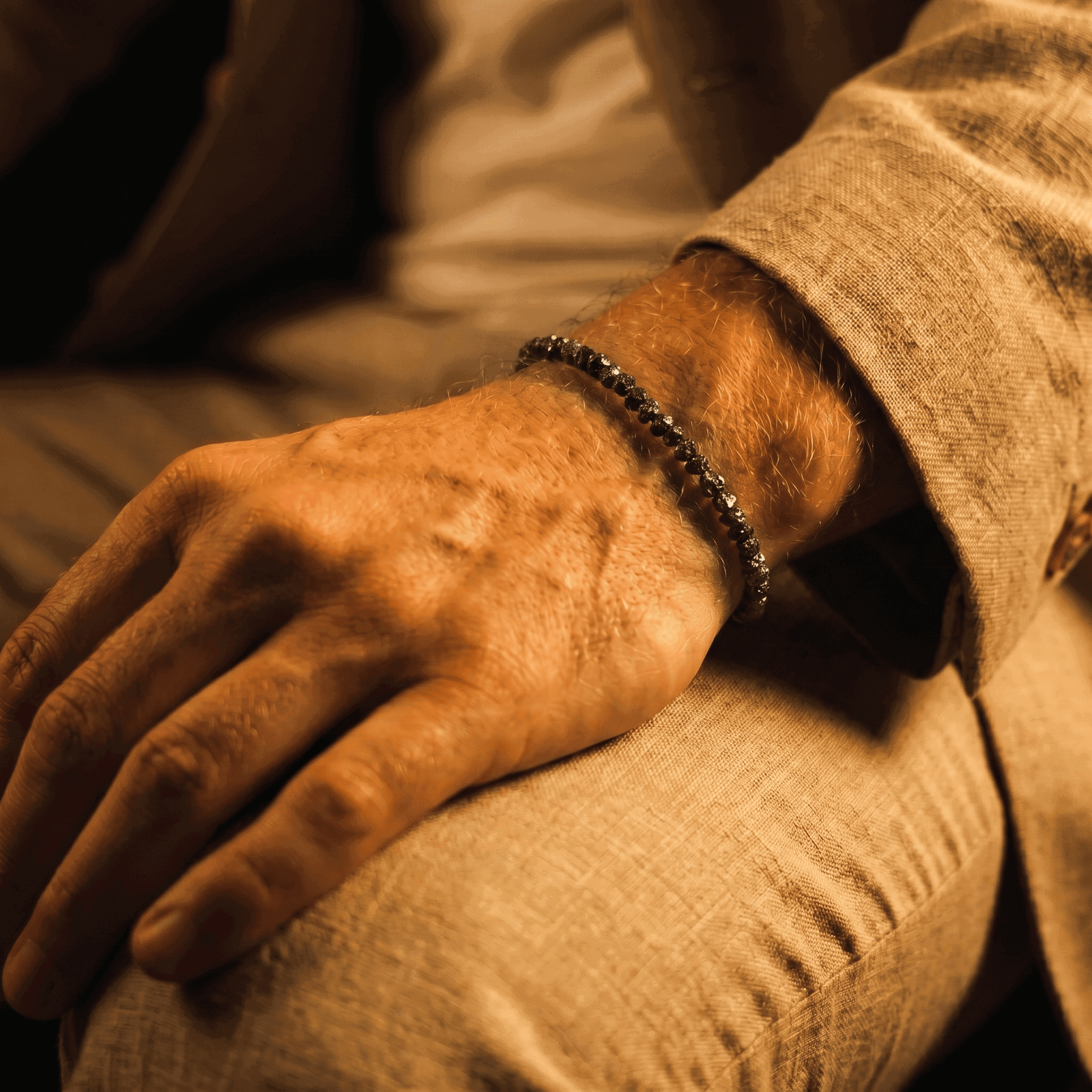Close wrist view of the 25-carat Raw Black Diamond Bracelet
