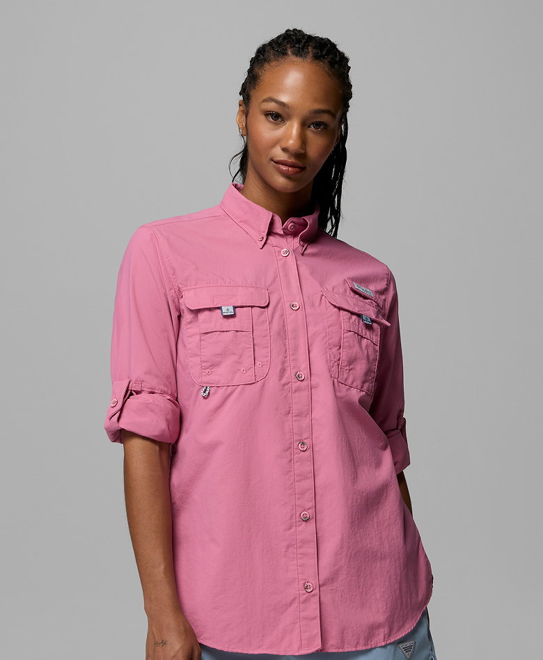 A woman wearing a pink long sleeve shirt