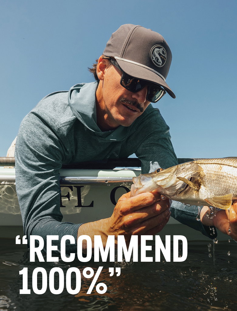A man holding a fish, headline 