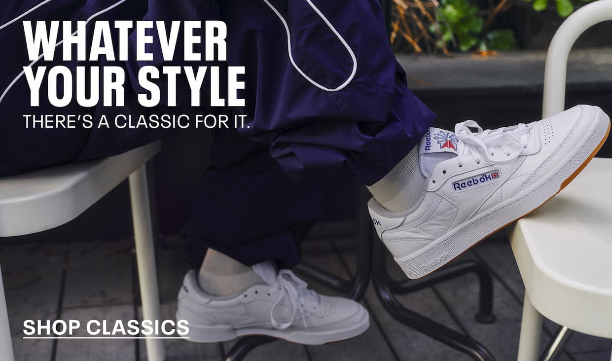Close-up of white Club C 85 sneakers worn in a casual outdoor setting. Text reads: “WHATEVER YOUR STYLE. THERE’S A CLASSIC FOR IT. Shop Classics.”