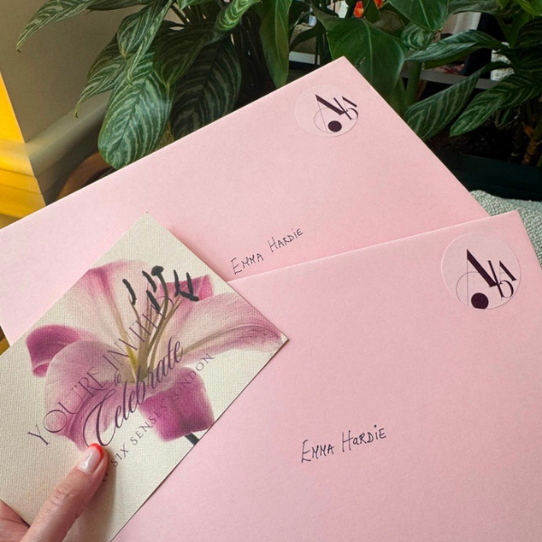 Pink Attracta Beauty Awards envelope featuring a botanical illustration.