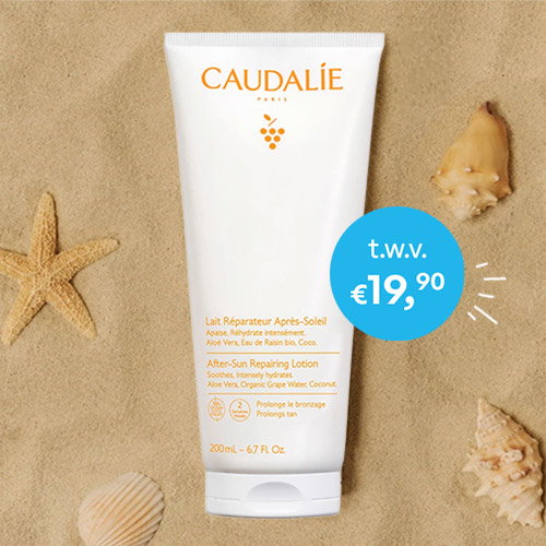 Tube of Caudalie After‑Sun Repairing Lotion on sand with seashells and starfish, promotional €19.90 badge