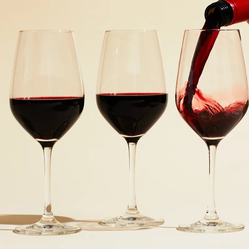 Three glasses of red wine. 