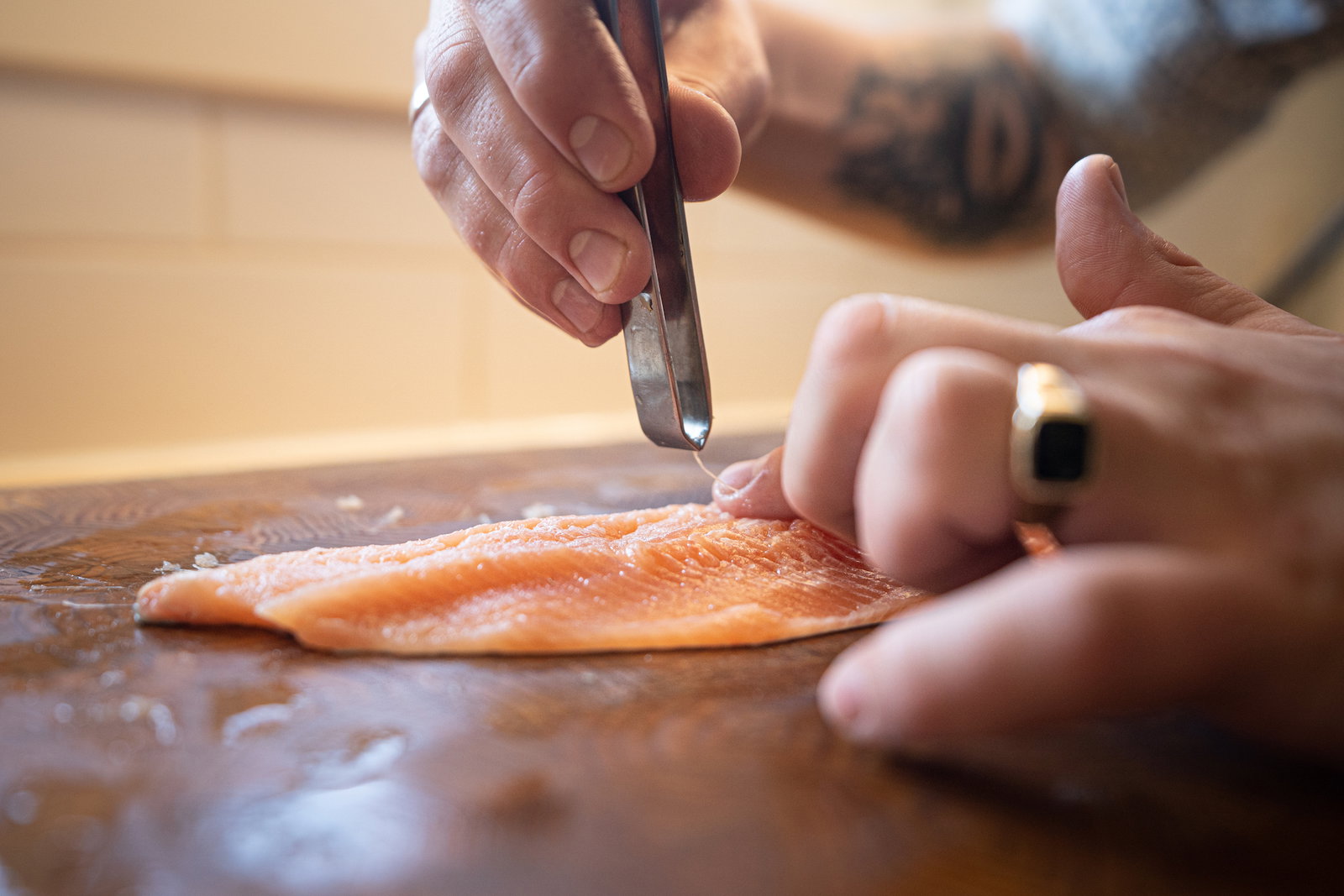 Pulling bones out of steelhead fillet