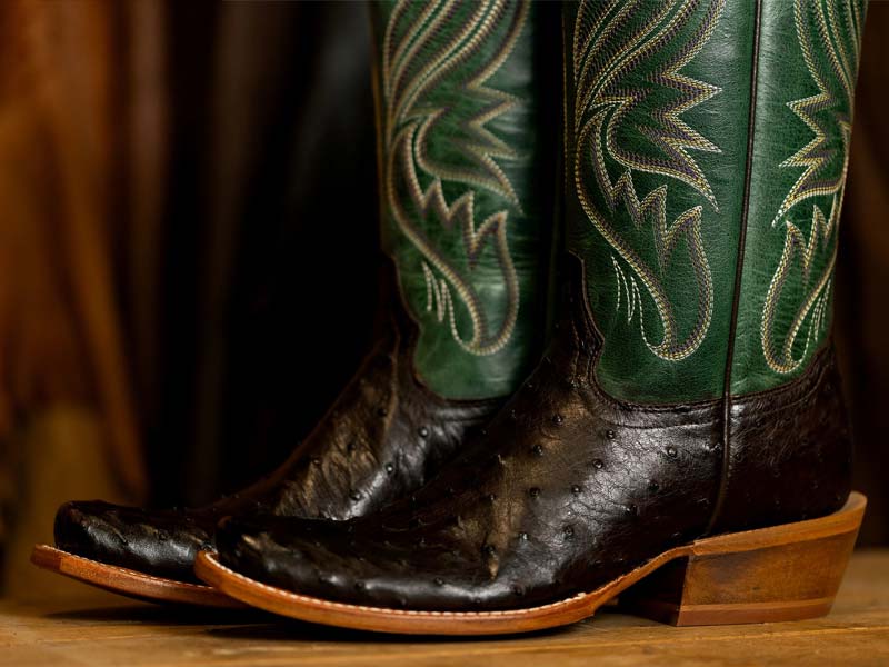 Tony Lama boot on a wooden table.