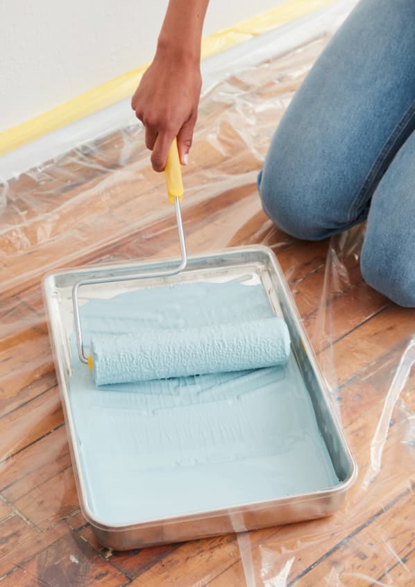 Rolling roller in blue paint color