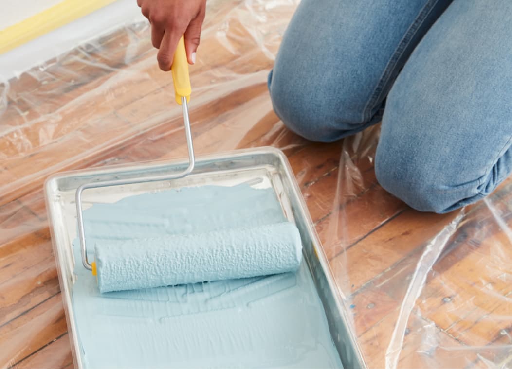 Rolling roller in blue paint color