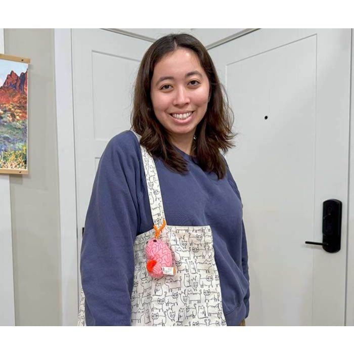Model with bag and Brain key chain