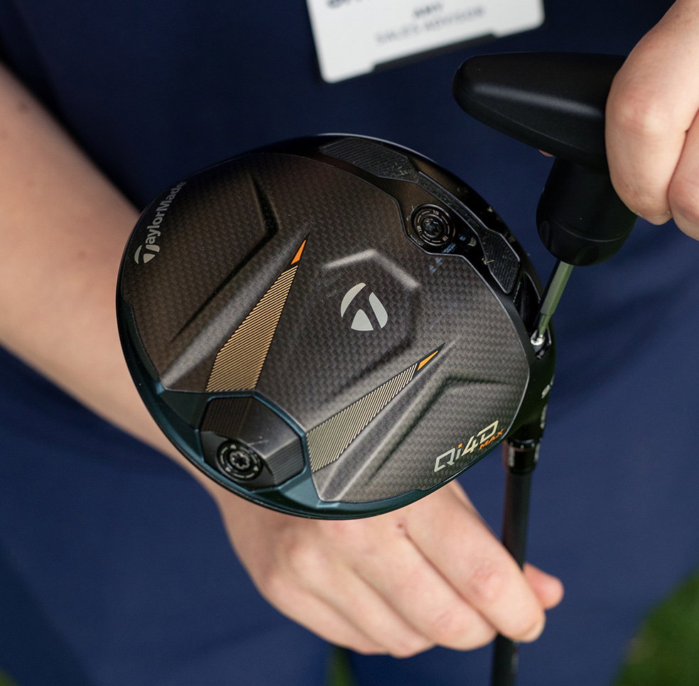 golf club being adjusted 