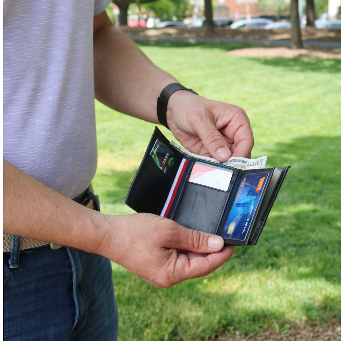 Man holding black wallet
