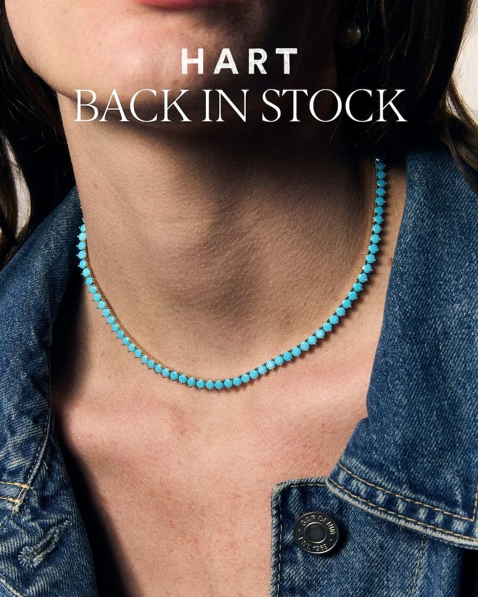 Back in Stock headline text; Model wearing the Turquoise Tennis Necklace and denim jacket