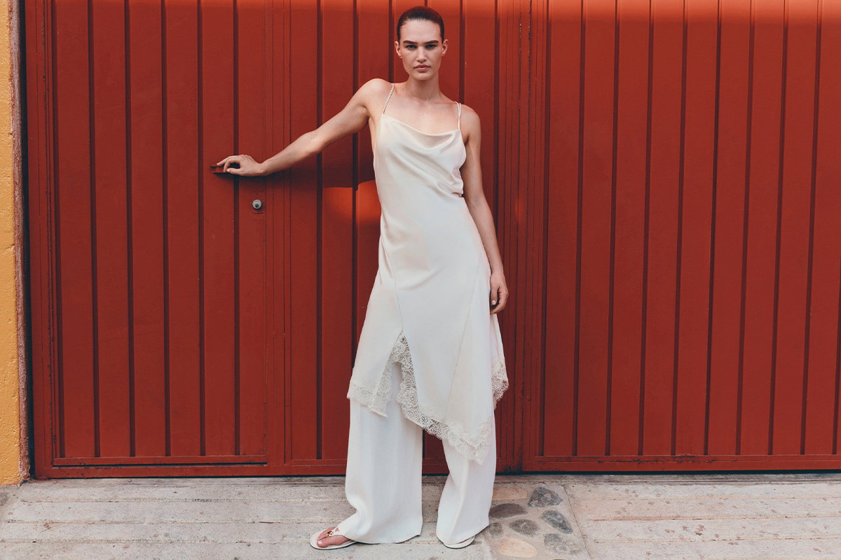 Woman wearing Ivory Satin Cowl Neck Lace Insert Midi Slip Dress
