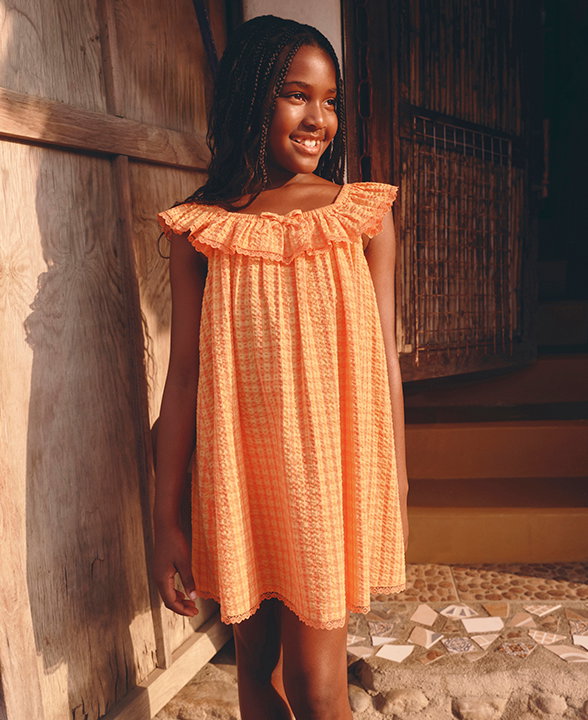 Girl wearing Orange Mix Gingham Check Baby Doll Dress
